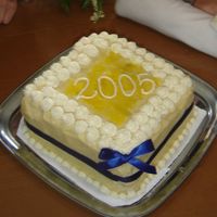 Blue And Yellow Graduation Cake White cake with Buttercream Frosting and Blue Ribbon.