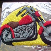 Motorbike Cake I made this cake from a Wilton shaped pan, for my father-in-law on Fathers Day.He was very pleased with it.:)
