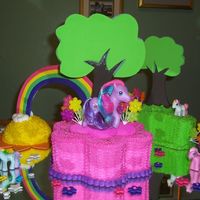 My Little Pony Cake with buttercream. The rainbow is made of gumpaste and fondant. The trees are styrofoam.