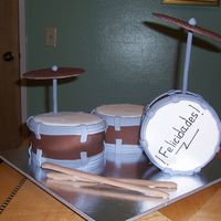 Drum Kit This was made of two 6" round pan covered in fondant. The third one is a dummy. The round " thing" ( I don't know the...