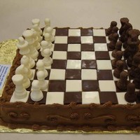 Chess Board Cake All solid chocolate molded chess pieces and board, with chocolate buttercream icing.