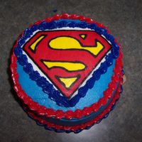 Superman 3 layer checkerboard cake, buttercream icing, superman logo is fbct