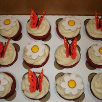 Butterflies And Flowers Royal icing butterflies and flowers on red velvet cupcakes. TFL!