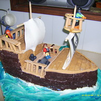 Pirate Ship this was a cake for my son who is allergic. sadly he could not eat the cake. a pirate ship with chocolate dough on the sides of the ship,...
