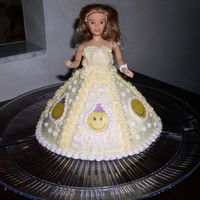 Smiley Face Doll Cake This was for my Daughter's 4th BDAY...She had a smiley face theme...did matching cupcakes with smile face rings on them.