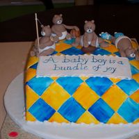 Baby Shower Bears Vanilla cake covered in fondant with painted blue and yellow diamonds. Bears and message plaque are gumpaste. Mom-to-be is having a boy and...