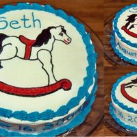 Rocking Horse My first attempt at a swag done on the side of the cake. This was done freehand with a variation of tips and buttercream frosting.