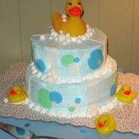Everything's Ducky--Baby Shower This cake was inspired by others from cc. BC with fondant accents. The ducks are just purchased bath toys.