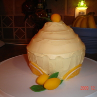 Giant Lemon Cupcake Mom gave me a giant cupcake pan for Christmas - first one I made was a lemon cake, lemon filling and lemon frosting - the lemons and leaves...