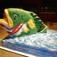 Fishing Anyone?! The fish is from a mold, cut off the tail to have him jumping out of the water to catch the worm hanging out of his mouth. Covered in candy...