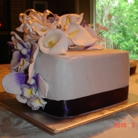 Daughter's Wedding Buttercream with gumpaste flowers. White cake filled with white and chocolate mousse. Silk ribbon. Got so tied up in baking, decorating and...