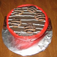 Weber Grill Cake When I think of the 4th of July I think of a barbeque with my family! My cake is a chocolate cake with chocolate filling. The grill is made...