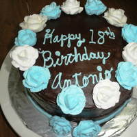 Blue White And Brown White and Carolina blue roses on chcocolate fudge buttercream