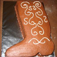 Cowboy Boot This is cut from a 9x13, covered in chocolate buttercream, and the detailing is cream cheese frosting.