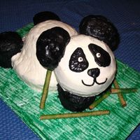 Panda Cake This was done using a 9"round, 6" round, small bowl, and 8 cupcakes. Ears are rice crispys, frosting is buttercream. Many skewers...