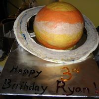 Saturn Cake I made this for my space-crazed little boy. I used a ball pan set with Snickerdoodle cake, cinnamon buttercream frosting colored with...