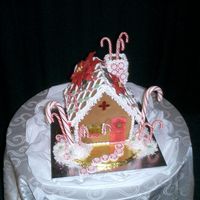 Candy Cane Cottage This homemade gingerbread house has candy windows, fondant poinsettias, and lots of peppermint candies! Dusted with white sparkle dust and...