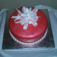 Holiday Cake - Red Fondant red fondant with a white bow - covered with touch of red pearl and white sparkle