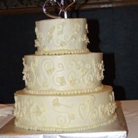 Round Ivory Wedding Cake White Scratch Cake with Raspberry Filling and White Chocolate Italian Meringue Buttercream. The bride wanted something very simple.