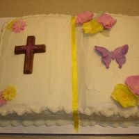 First Holy Communion Vibrant blooms, daisies, & butterfly are made from fondant. Cross is chocolate. Sprinkled with edible glitter.