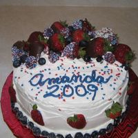 Graduation Cake White cake with Strawberry filling covered in whipped cream, regular and chocolate covered strawberries and plain and chocolate covered...