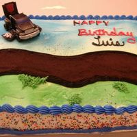 Birthday Cake For My Nephew. Transformers This was a last minute cake. Thank God for Fast food toys...Transformer car taking flight on a dirt road. Vanilla cake with buttercream...