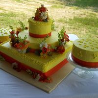 Flowers At The Cabin Wedding Cake I did this cake as a wedding gift to one of my best friends. Her colors were orange and green and the flowers were daisies and wildflowers...