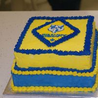 Cub Scout Cake This was for our Blue and Gold dinner in 2009. The Cub Scout logo was done using color flow.