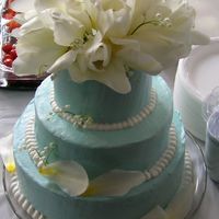 3 Tier With Tulips Anniversary cake 12,9, 6 inch tiers frosted with Italian Meringue Buttercream. Natural Tulips & Lilies of the Valley. I was rushing to...