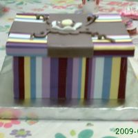 Gift Box a gift box, cover with fondant and frosting sheets printed with colors strips. you can open the box and inside was the present