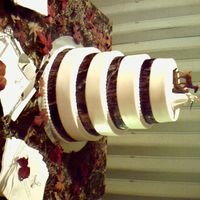 Mossy Oak Wedding Cake Swirl cake with strawberry filling and buttercream, with a mussy oak cloth ribbon. This was the theme of the wedding