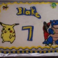 Pokemon Cake I made this cake for my grandson's 7th birthday. Pikachu and Blastoise. They are buttercream transfers which I really don't like...