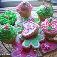 Cupcakes I made these cupcakes to match a one year old birthday cake that I made. Buttercream icing, fondant flowers. Hershey Chocolate cake and...