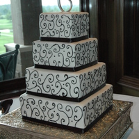 Black Scroll All buttercream with the exception of the ribbon around the bottom.