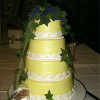 A Little Of Yellow cake covered in fondant with real floral and burlap ribbon
