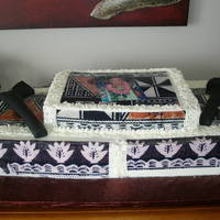 80Th Birthday Cake Butttercream icing with fondant tapa edible prints. War clubs made of fondant.