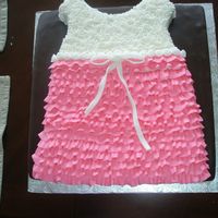 Baby Shower Cake Baby's cute frilly dress. Chocolate fondant and buttercream for the dress.