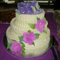 Basket Weave With Gumpaste Hibiscus Flowers I did this for a cake for a 50th birthday party. The cake was lemon with pineapple manderin orange filling. I iced it in buttercream. It...