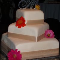 Off-Set Square Wedding Cake This is a 3-tiered offset square wedding cake (12",8" and 6") frosted with buttercream then topped with ivory marshmallow...