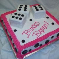 Bunko Cake This is an 11x11 cake iced with buttercream. The dice are cake squares covered with mashmallow fondant. The black dots are also MMF.