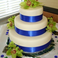 Tropical Beach Wedding Cake This was for a beach wedding; the bride wanted tropical without the traditional seashells and starfish so she opted for orchids and peacock...