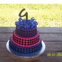 Kayla's Birthday This cake was in the wilton fun with fondant book. It was originally 5 tiers with pastel colors and white dots. My friends daughter picked...