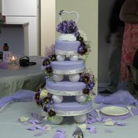 Lavender And Ivory four tier. top strawberry, second lemon, third chocolate, fourth white. I arranged the live flowers on the cake but had a little trouble...