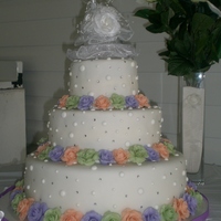 Simple And Elegant This was the first wedding cake I did professionally, and only my second wedding cake ever. The top and bottom layers were chocolate (which...