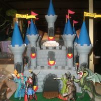 World Of Warcraft Castle my nephew is a huge world of warcraft fan so we found some figurines and put them in front of this castle since they dont have any wow cake...