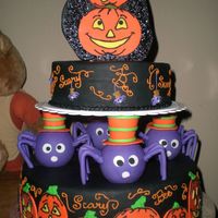 Spooky Pumpkins inspired by the wilton yearbook, I changed it up a little and added my own topper made of gumpaste