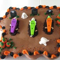 Halloween Cupcake Cake My first cupcake cake. I made this for my daughters Brownie troop. The coffins and tombstones are from a purchased kit. The ghosts are mini...