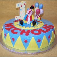 Nicholas' First Birthday Cake Clown cake for a first birthday. Clown and balloons were hand molded using fondand + gumtex. I had a lot of fun making this cake.