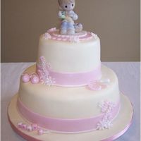 Baby Shower Cake Cake covered in fondant. Hand molded baby "things". Precious Moments cake topper.