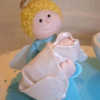 Angel And Baby Fondant+gumtex hand molded angel and baby for a baptism cake.